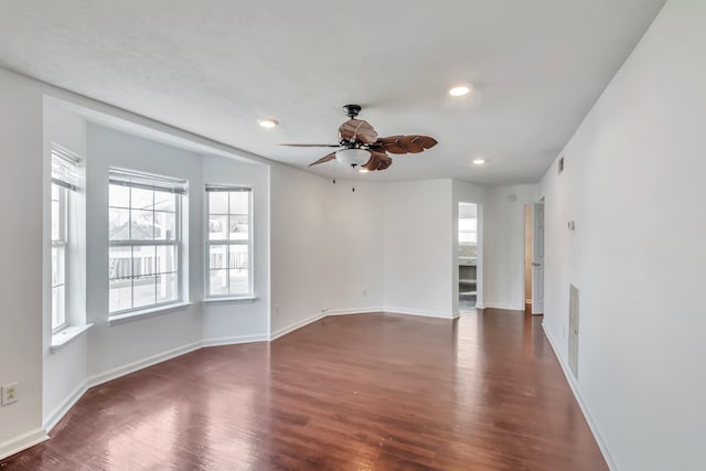 unfurnished living room featuring recessed lighting, dark wood-style flooring, baseboards, visible vents, and a ceiling fan