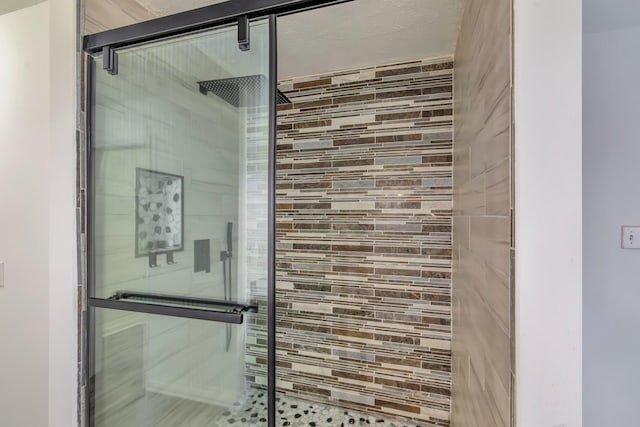 bathroom featuring a shower stall