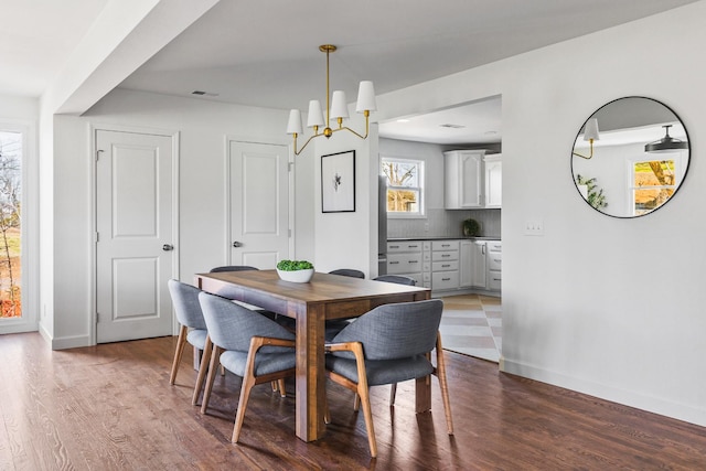 234 Spring St, La Vergne, TN 37086 - dining room featuring baseboards, visible vents, and wood finished floors