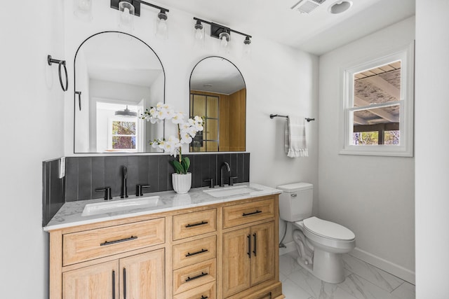 234 Spring St, La Vergne, TN 37086 - full bathroom featuring visible vents, a sink, marble finish floor, and toilet