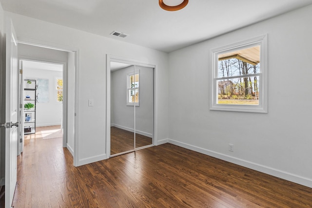 234 Spring St, La Vergne, TN 37086 - unfurnished bedroom with baseboards, visible vents, and multiple windows