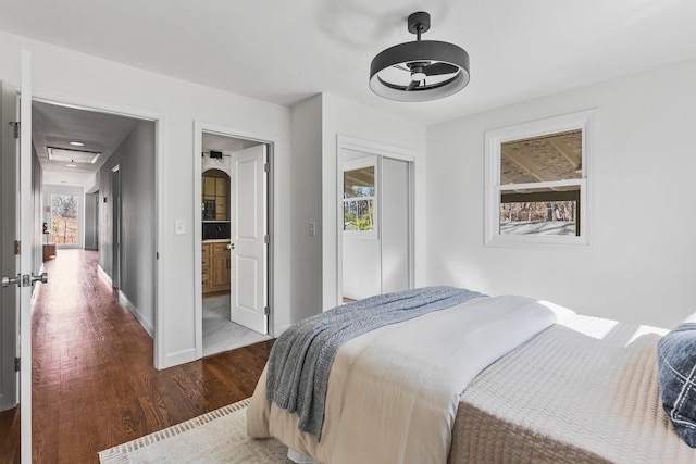 234 Spring St, La Vergne, TN 37086 - bedroom featuring baseboards, a closet, and wood finished floors