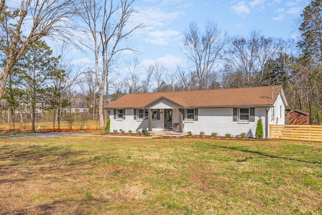 234 Spring St, La Vergne, TN 37086 - ranch-style home featuring brick siding, fence, a front yard, and a porch