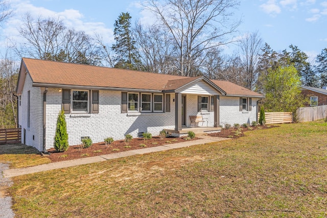 234 Spring St, La Vergne, TN 37086 - ranch-style home featuring brick siding, a front lawn, and fence