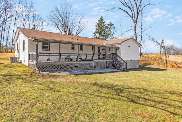 234 Spring St, La Vergne, TN 37086 - rear view of house featuring a wooden deck, a yard, central AC, and brick siding