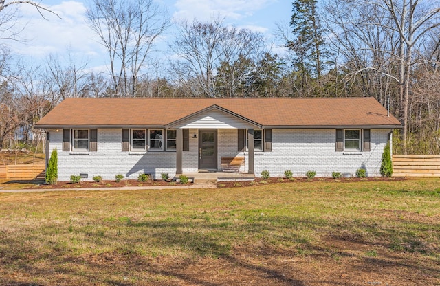 234 Spring St, La Vergne, TN 37086 - ranch-style house with a porch, brick siding, fence, and a front lawn