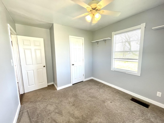 1088 Poole Mill Rd, Crofton, KY 42217 - unfurnished bedroom with baseboards, dark carpet, visible vents, a ceiling fan, and a closet