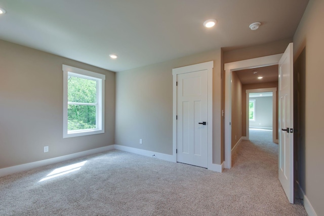 1151 Canaan Rd, Columbia, TN 38401 - unfurnished bedroom featuring light carpet, multiple windows, recessed lighting, and baseboards