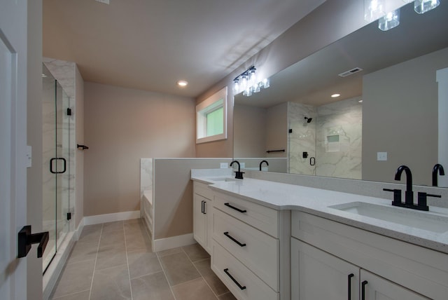1151 Canaan Rd, Columbia, TN 38401 - full bath featuring a shower stall, a bath, double vanity, baseboards, and recessed lighting
