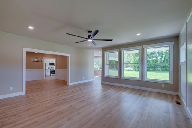 1151 Canaan Rd, Columbia, TN 38401 - unfurnished living room with a chandelier, light wood finished floors, ceiling fan, baseboards, and recessed lighting