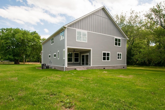 1151 Canaan Rd, Columbia, TN 38401 - rear view of house featuring board and batten siding, ceiling fan, a patio, and cooling unit