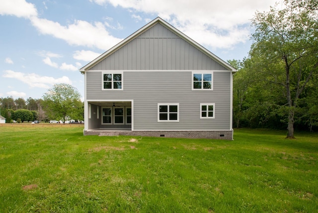 1151 Canaan Rd, Columbia, TN 38401 - rear view of property with a lawn and board and batten siding