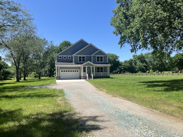 1151 Canaan Rd, Columbia, TN 38401 - view of front of property with dirt driveway, covered porch, and a garage
