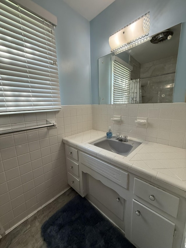 106 W Park Dr, Clarksville, TN 37043 - full bathroom with wainscoting, vanity, a shower with shower curtain, tile walls, and wood finished floors