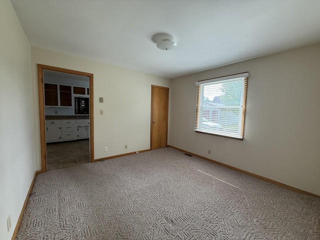 106 W Park Dr, Clarksville, TN 37043 - unfurnished bedroom with baseboards, light carpet, and visible vents
