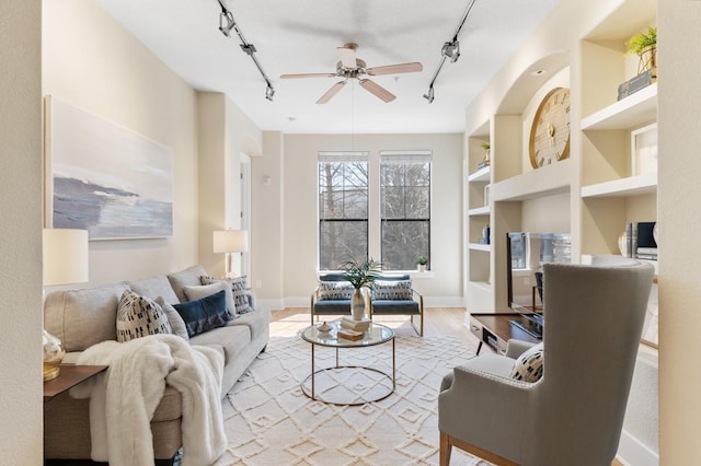 2600 Hillsboro Pike Unit 204, Nashville, TN 37212 - living room featuring built in features, ceiling fan, baseboards, and rail lighting