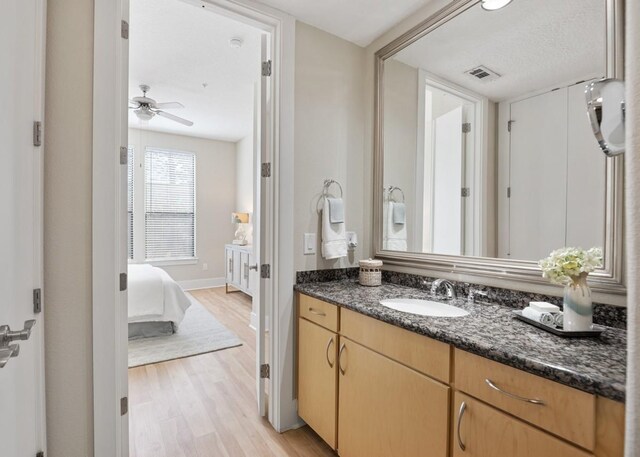 2600 Hillsboro Pike Unit 204, Nashville, TN 37212 - bathroom with vanity, visible vents, ensuite bathroom, ceiling fan, and wood finished floors