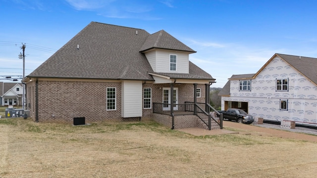 1121 Joe Martin Ln, Lebanon, TN 37087 - rear view of property featuring a shingled roof and brick siding