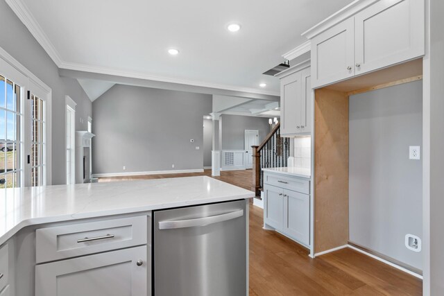 1121 Joe Martin Ln, Lebanon, TN 37087 - kitchen with stainless steel dishwasher, open floor plan, light wood-style flooring, ornamental molding, and recessed lighting