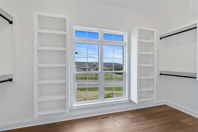 1121 Joe Martin Ln, Lebanon, TN 37087 - spacious closet featuring dark wood-style flooring, visible vents, and a barn door