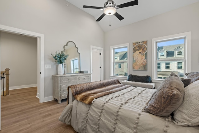 205 Charlotte Everly Cir, Hendersonville, TN 37075 - bedroom featuring baseboards, high vaulted ceiling, light wood-style floors, and ceiling fan