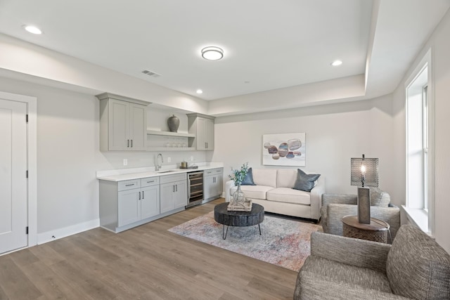 205 Charlotte Everly Cir, Hendersonville, TN 37075 - living room featuring visible vents, indoor wet bar, wine cooler, and light wood-type flooring