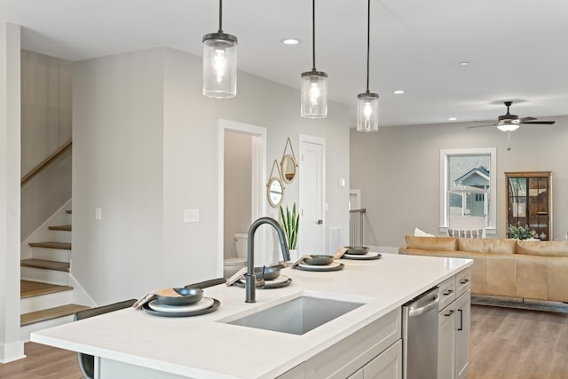 205 Charlotte Everly Cir, Hendersonville, TN 37075 - kitchen with open floor plan, light countertops, a sink, and dishwasher