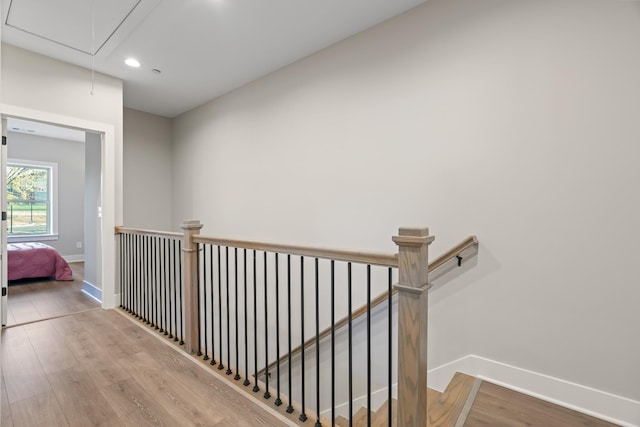 205 Charlotte Everly Cir, Hendersonville, TN 37075 - hallway featuring baseboards, an upstairs landing, wood finished floors, and attic access