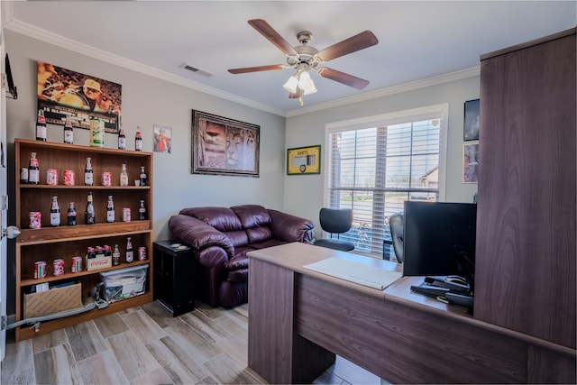 office space featuring ceiling fan, visible vents, and crown molding