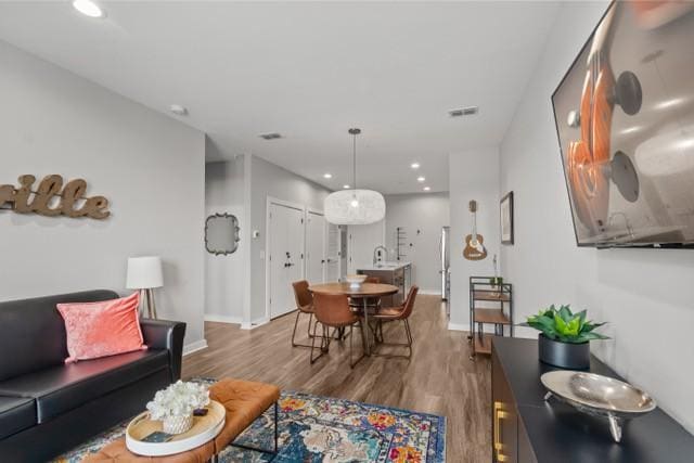 5403 Centennial Blvd Unit 203, Nashville, TN 37209 - living area featuring recessed lighting, visible vents, baseboards, and wood finished floors