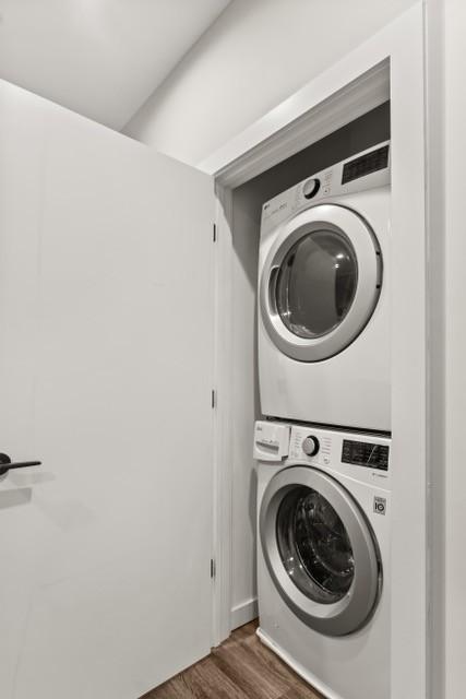5403 Centennial Blvd Unit 203, Nashville, TN 37209 - laundry room featuring stacked washer and dryer, laundry area, and wood finished floors