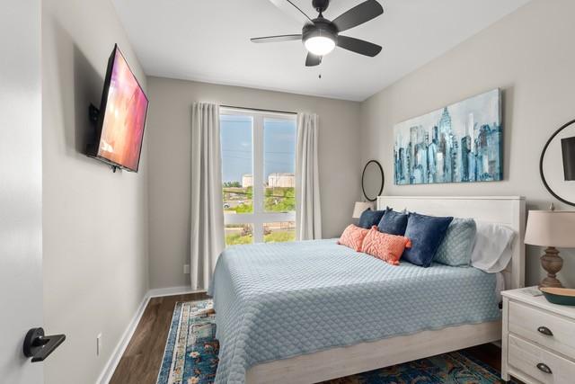 5403 Centennial Blvd Unit 203, Nashville, TN 37209 - bedroom with a ceiling fan, dark wood-style floors, and baseboards