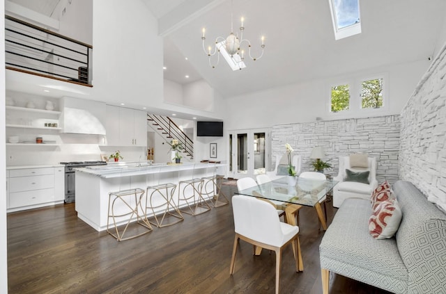 915 Overton Lea Rd, Nashville, TN 37220 - dining room with high vaulted ceiling, stairway, dark wood-type flooring, a chandelier, and a skylight