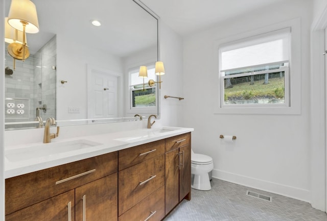 915 Overton Lea Rd, Nashville, TN 37220 - full bathroom featuring double vanity, a shower stall, healthy amount of natural light, and tile patterned floors