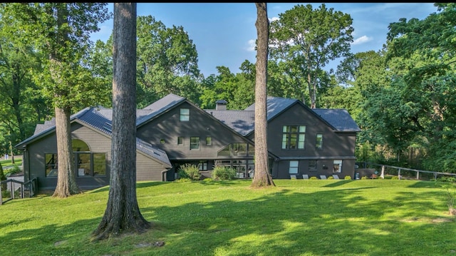 915 Overton Lea Rd, Nashville, TN 37220 - rear view of house with a chimney and view of wooded area