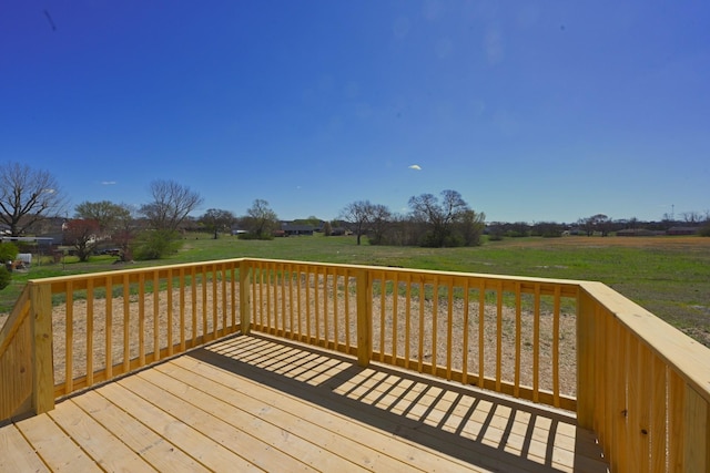 wooden deck with a lawn