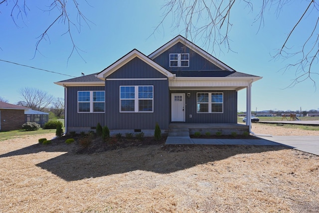 bungalow-style home with a porch and crawl space