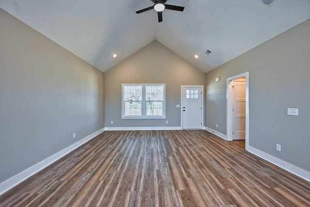 unfurnished living room featuring dark wood-style floors, high vaulted ceiling, ceiling fan, and baseboards