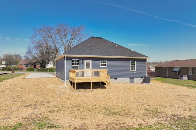 rear view of house featuring crawl space, a shingled roof, a deck, and central AC