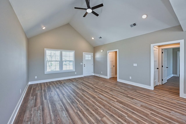 interior space featuring wood finished floors, baseboards, ceiling fan, and visible vents