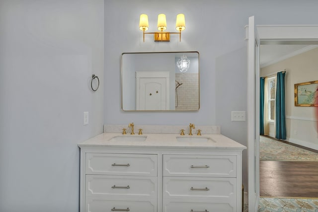 230 Anchor Dr, Waverly, TN 37185 - bathroom with double vanity, crown molding, wood finished floors, and a sink