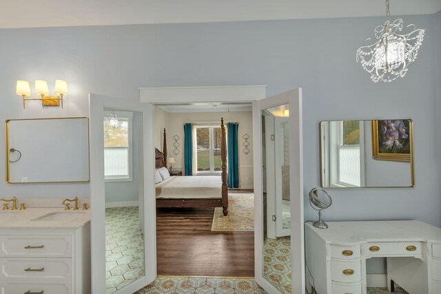 230 Anchor Dr, Waverly, TN 37185 - ensuite bathroom with vanity, ensuite bath, a chandelier, and wood finished floors