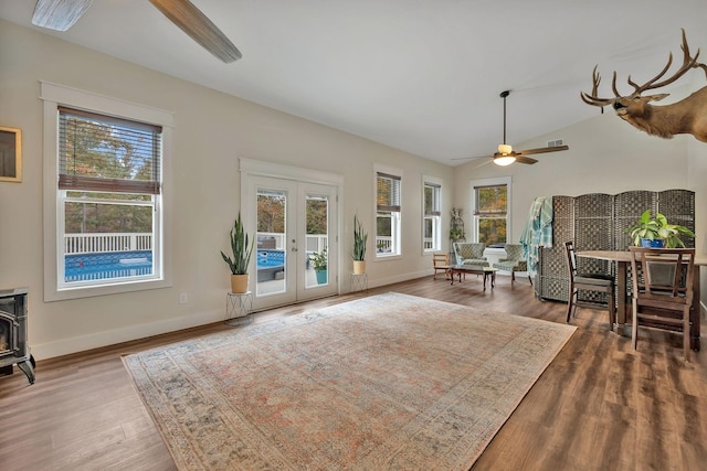 230 Anchor Dr, Waverly, TN 37185 - living area with french doors, a healthy amount of sunlight, a wood stove, and ceiling fan