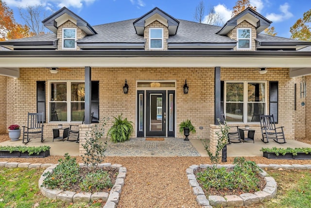 230 Anchor Dr, Waverly, TN 37185 - view of front of house featuring a shingled roof, covered porch, and brick siding