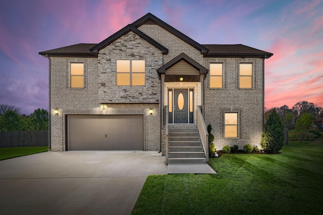 2263 Allen Griffey Ct, Clarksville, TN 37042 - view of front facade featuring an attached garage, fence, a lawn, concrete driveway, and brick siding