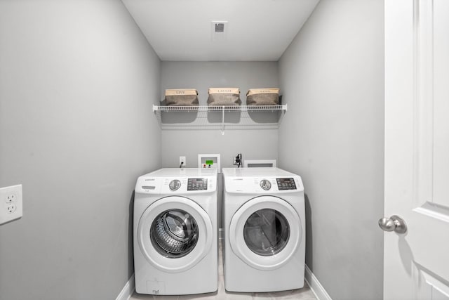 2263 Allen Griffey Ct, Clarksville, TN 37042 - laundry room featuring baseboards, washing machine and dryer, laundry area, and visible vents
