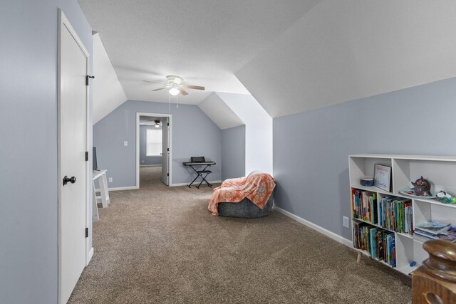 1571 Barrett Dr, Clarksville, TN 37043 - living area featuring baseboards, carpet floors, lofted ceiling, and a ceiling fan