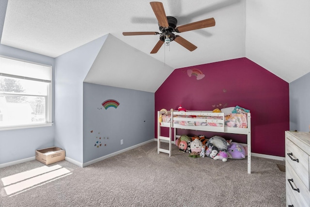 1571 Barrett Dr, Clarksville, TN 37043 - carpeted bedroom with baseboards, lofted ceiling, a textured ceiling, and a ceiling fan