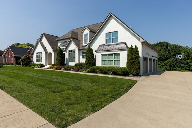 836 Savannah W Ct, Springfield, TN 37172 - view of front of home with a standing seam roof, concrete driveway, a front yard, and metal roof