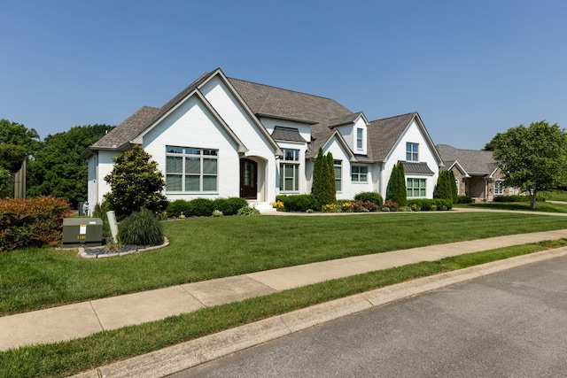 836 Savannah W Ct, Springfield, TN 37172 - tudor home with a standing seam roof, a front yard, and metal roof